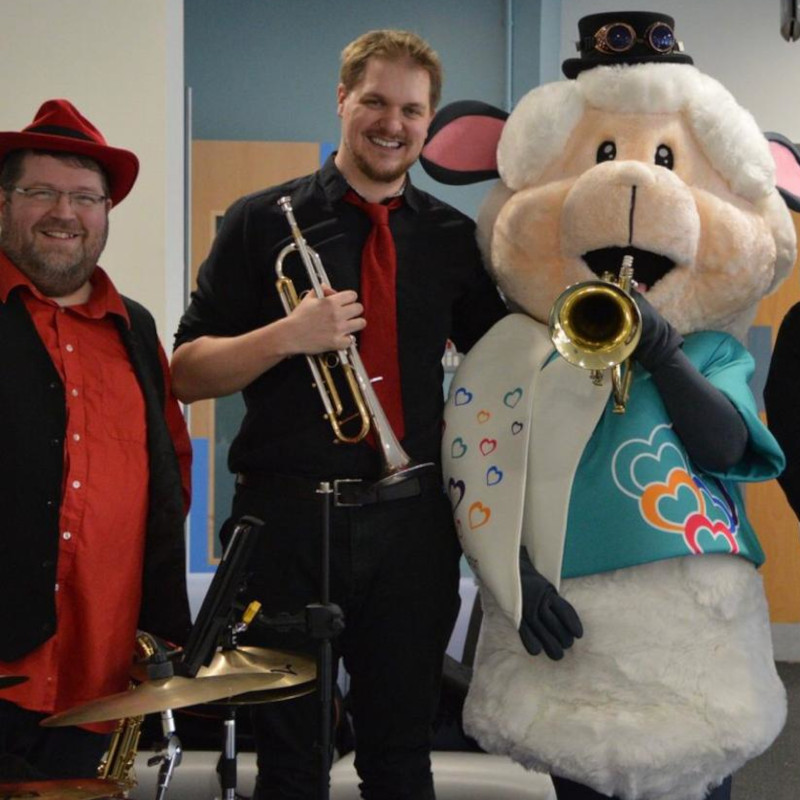 Tri Tones duo at UHDB Royal Derby Hospital Children's Ward, with Derby and Burton Hospitals Charity mascot